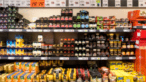 Supermarket shelf with various packaged goods