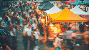 Crowded street market with colorful tents and people