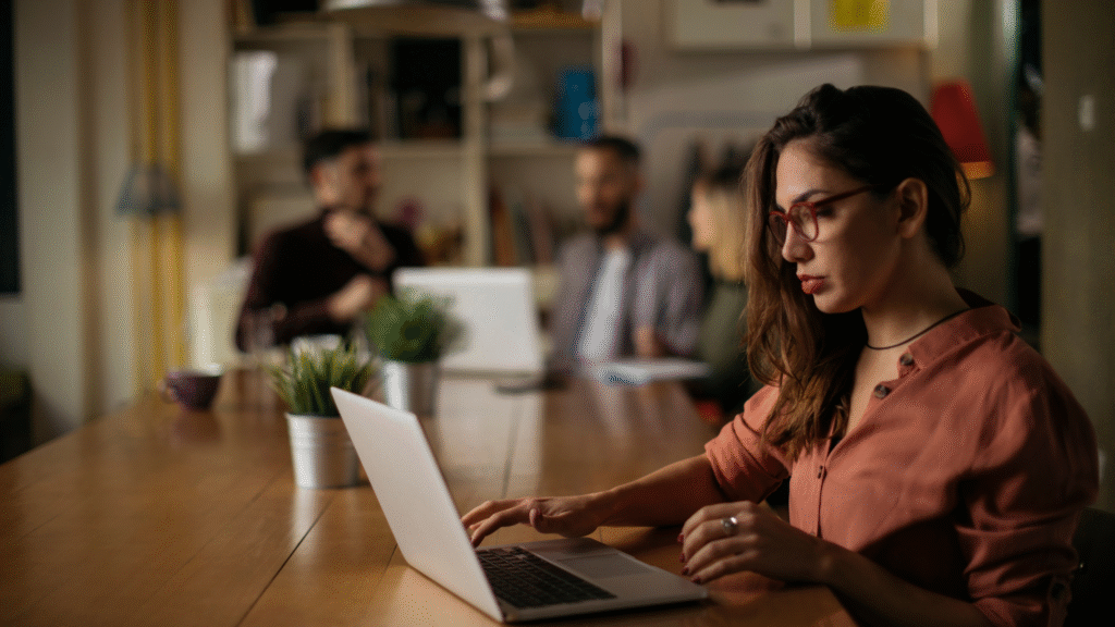Woman working on laptop in modern office
